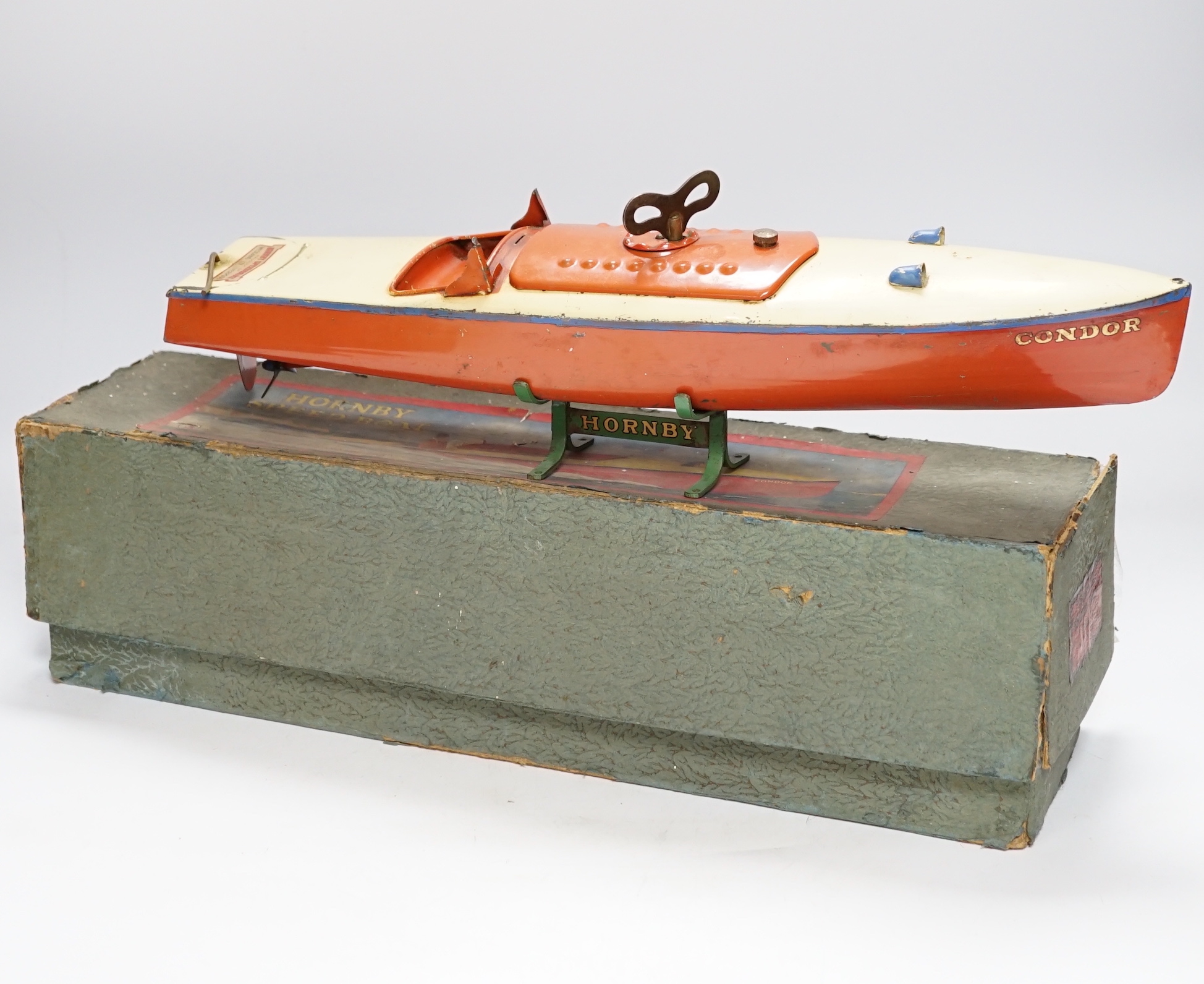A boxed, Hornby No.3 Condor clockwork speed boat, with original stand, length of hull 41.5cm